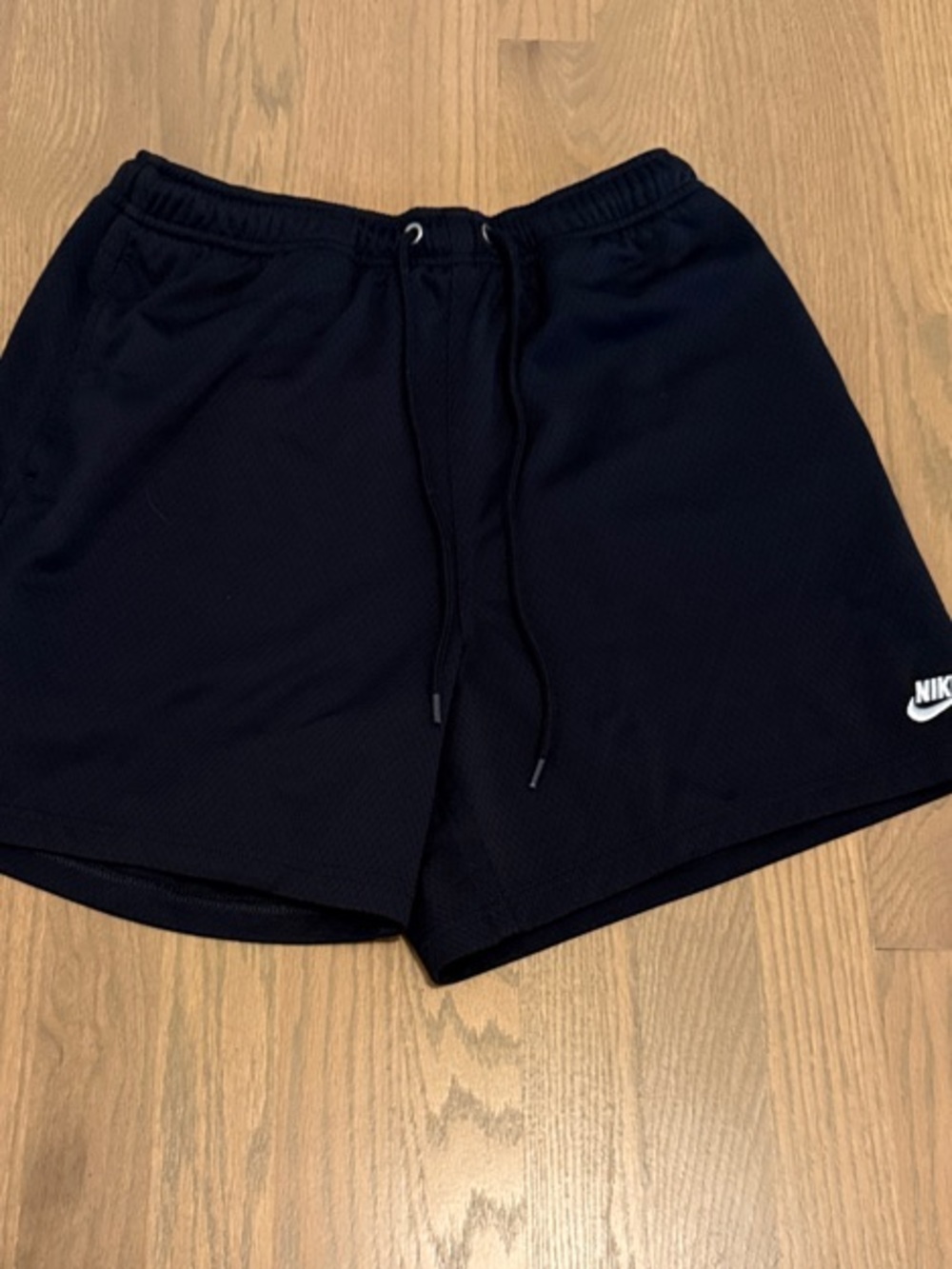 Nike Black Athletic Mesh Shorts with White Swoosh Logo